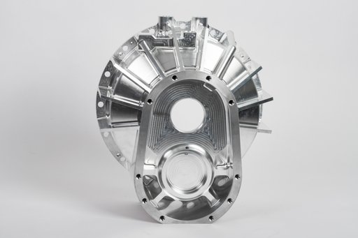 Silver-colored metal housing with circular openings, ribs and mounting holes.